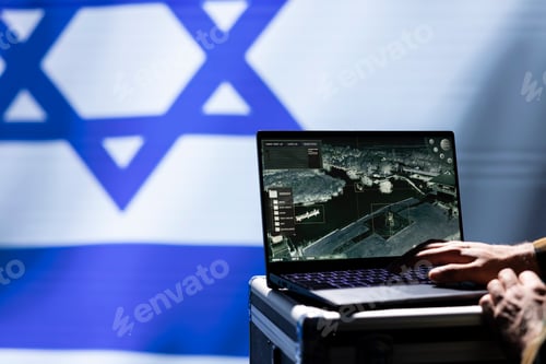 Preview: Military operative engaged in surveillance mission using laptop