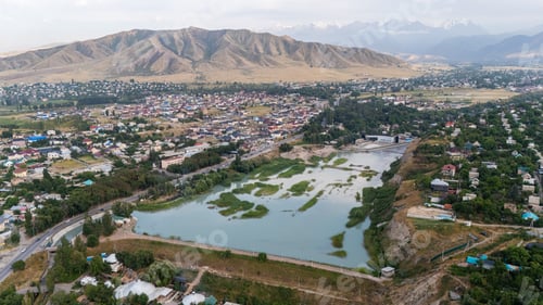 Preview: Aerial view of city with water bodies and residential areas
