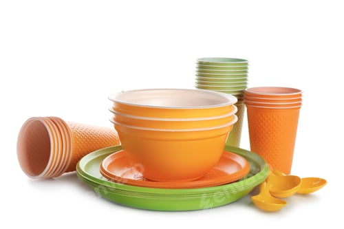 Preview: New plastic dishware on white background. Table setting
