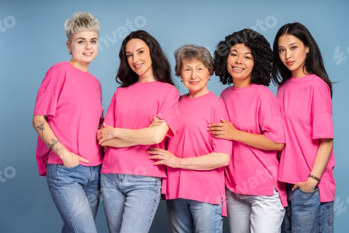 Preview: Five confident women of diverse ethnicities showing support for breast cancer awareness