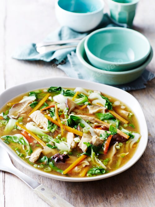 Preview: A bowl of hearty chicken and vegetable soup.