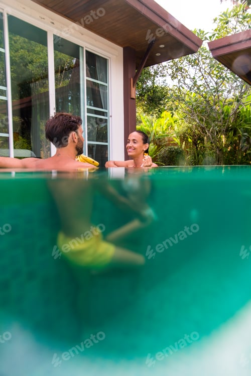 Preview: Couple of lovers in a beautiful villa with swimming pool