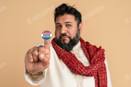 Preview: Indian man in a kurta showing a vote sticker