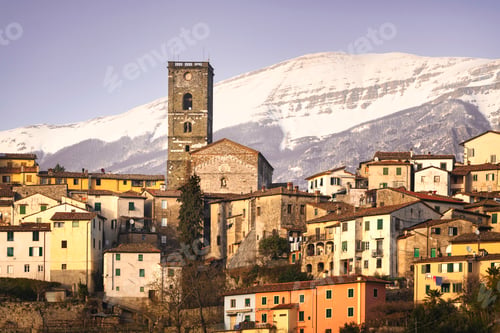Preview: Coreglia Antelminelli village and snowy mountains on background. Garfagnana, Tuscany, Italy.