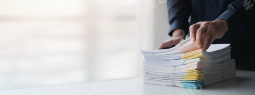 Preview: Businessman sorting stacks of department meeting papers, document management in corporate office. Of