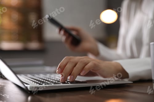 Preview: Woman working with laptop in office, closeup