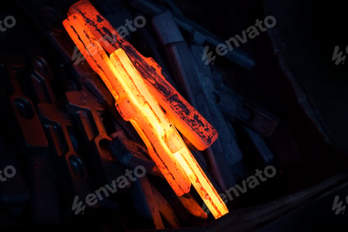Preview: Red hot newly forged straps (mining components) cooling down