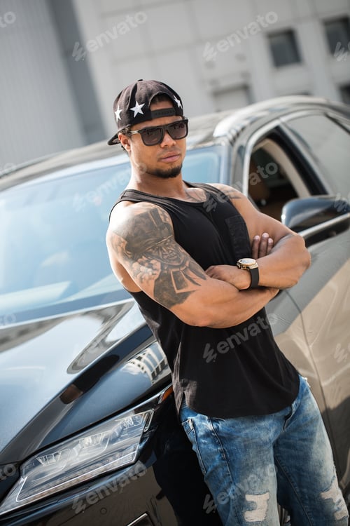 Preview: African American near the car.