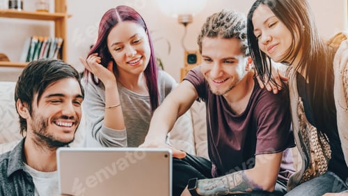 Preview: Young people friends sitting on couch, watching something on tablet, browsing online content.