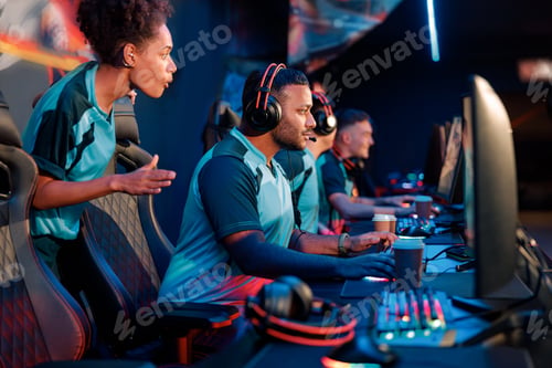 Preview: Skillful team practicing in gaming arena at internet club