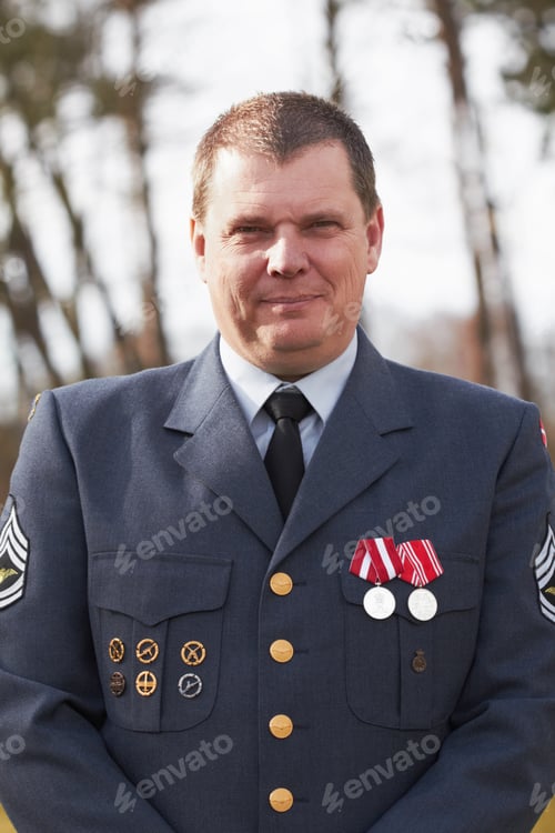 Preview: He has earned his medals. Cropped portrait of a high ranking military official standing outside.