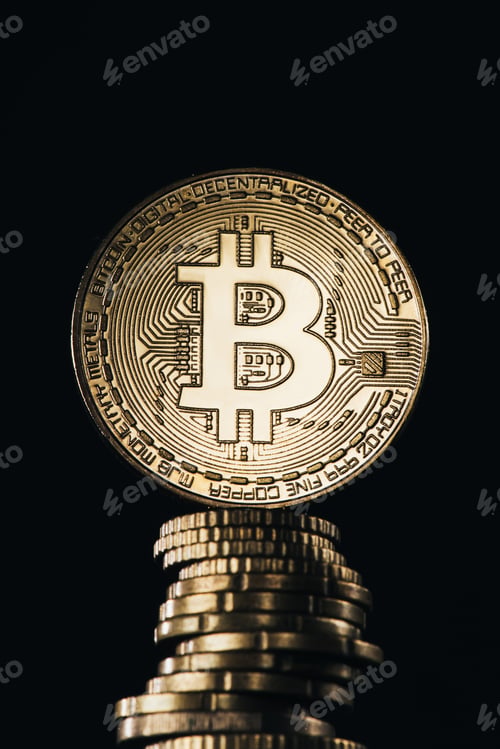 Preview: Close up view of pile of golden bitcoins isolated on black