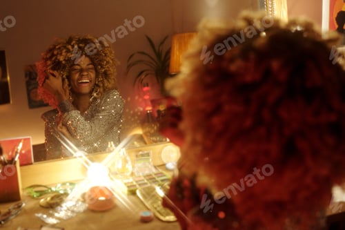 Preview: Smiling Woman with Curly Hair in Front of Mirror