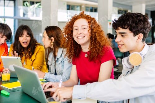 Preview: Happy young group of diverse students studying together and working together