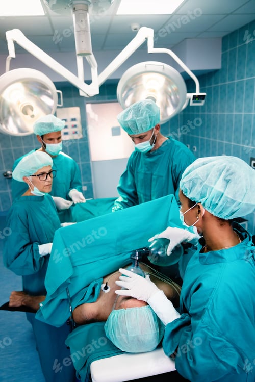 Preview: Group of surgeon team at work in operating room in hospital