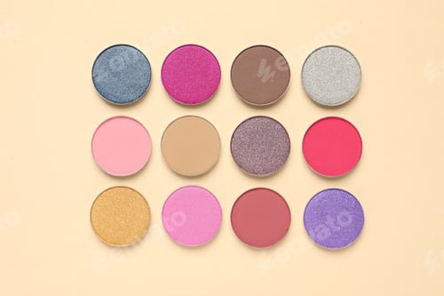 Preview: Different beautiful eye shadows on beige background, flat lay