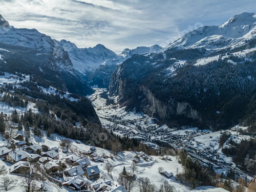 Preview: Lauterbrunnen Valley and Snowy Mountains in Winter. Switzerland. Aerial View