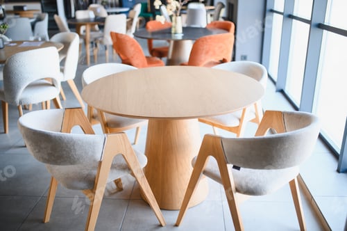 Preview: Modern dining area with wooden table and upholstered chairs