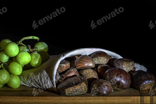 Preview: Closeup shot of chestnuts and green apricots