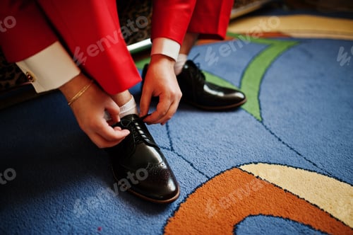 Preview: Handsome groom dressing up and getting ready for his wedding ceremony.