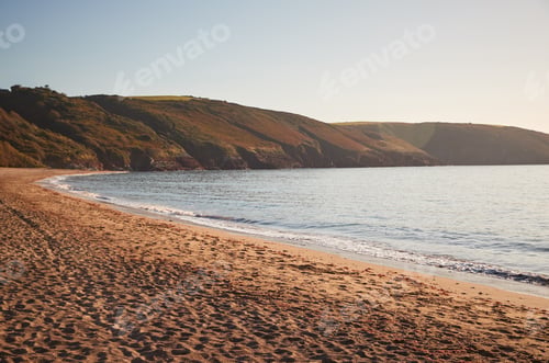 Preview: Evening Light Over Wide Angle View Of Beach In Wales UK