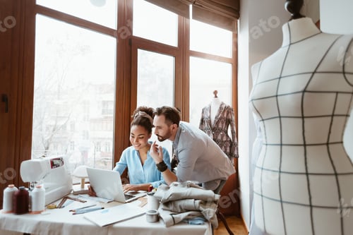 Preview: From paper to laptop. Man and woman at design studio
