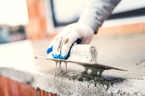 Preview: construction worker using steel trowel for plastering