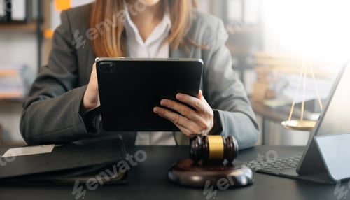 Preview: Asian man lawyer working and gavel, tablet, laptop in front, Advice justice and law concept.