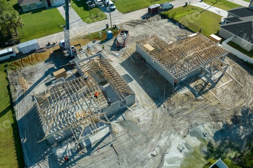 Preview: Professional builders and crane truck working on roof construction