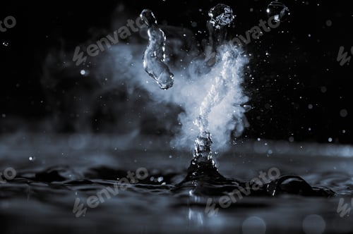 Preview: Boiling water splash with steam on black background closeup