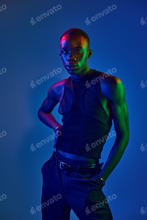Preview: Young african american man showcases vibrant style in a creative modern setting
