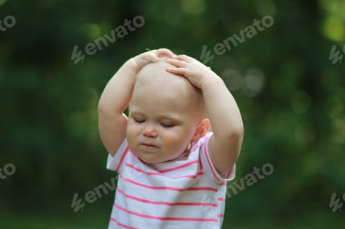 Preview: thoughtful child walking in the park