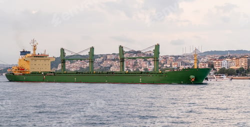 Preview: A large cargo ship travels along the Bosphorus with Istanbul's cityscape visible