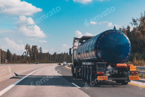 Preview: Fuel tanker truck on the highway asphalt road on fall autumn day