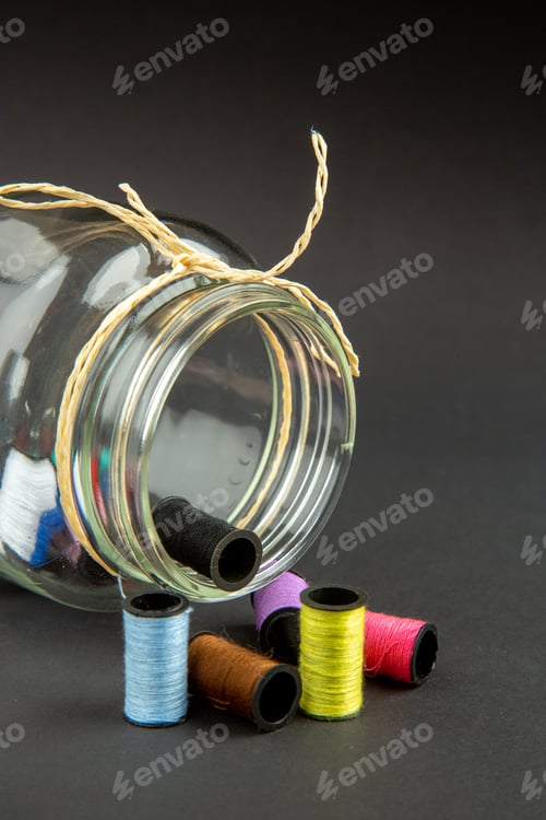 Preview: front view colorful threads with can on dark background darkness clothes pin sewing measure color
