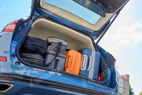 Preview: Car trunk full of suitcases and travel bags ready for relocation or road trip