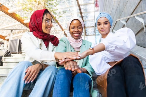 Preview: Beautiful muslim girl wearing hijab bonding outdoors