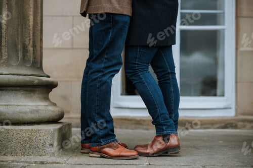 Preview: Lovely and romantic couple standing close to each other and kissing