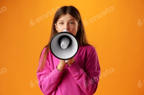 Preview: Teen girl making announcement with megaphone on yellow background