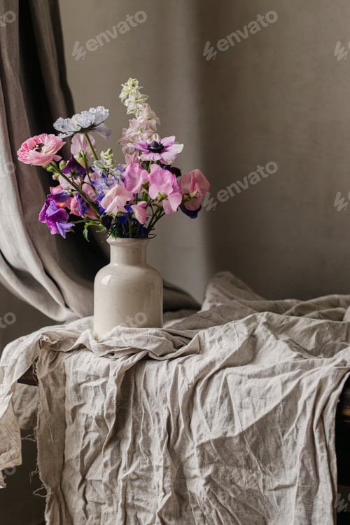 Preview: Stylish bouquet on rustic linen background. Beautiful colorful anemone, ranunculus
