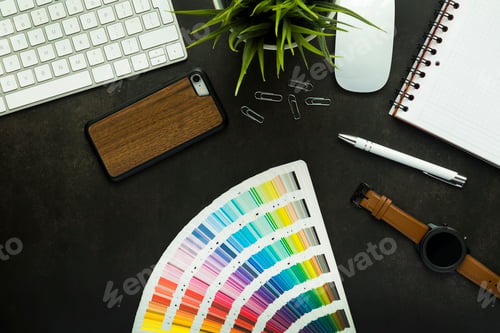 Preview: Graphic designer work space with black desk, top view