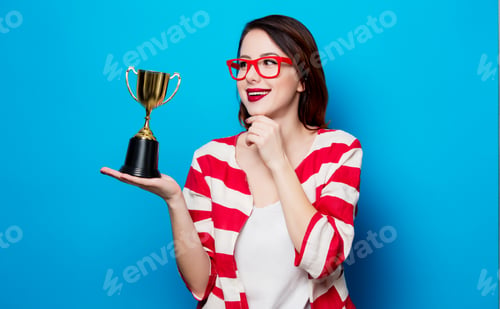 Preview: young smiling woman with cup trophy