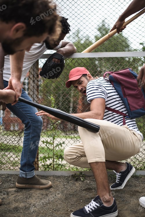 Preview: group of multiethnic men attacking other one with baseball bats