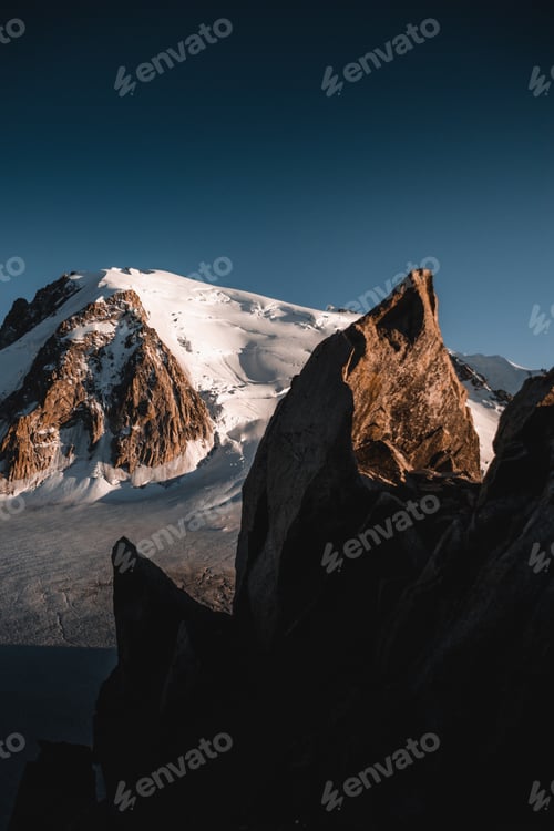 Preview: Golden light and shadow create a stunning contrast on Mont Blanc's icy peaks, Chamonix