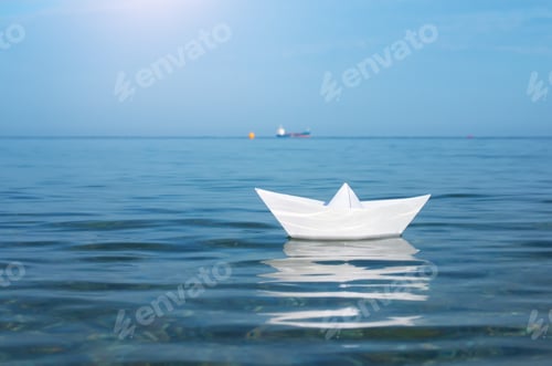 Preview: Paper toy ship and deep blue sea.