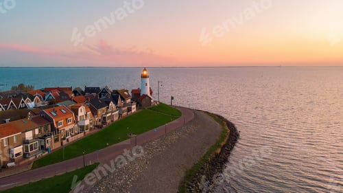 Preview: Urk Flevoland Netherlands sunset at the lighthouse and harbor of Urk Holland. Fishing village Urk