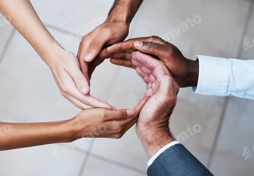 Preview: Cropped shot of a group of unrecognizable people joining hands in solidarity