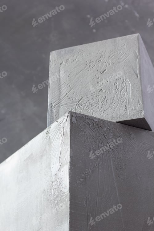Preview: Concrete cube or construction brick near wall background texture. Abstract concept
