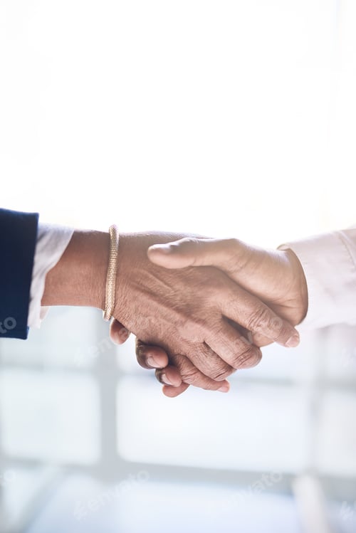 Preview: Shot of two unrecognizable businesspeople shaking hands in agreement