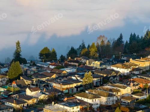 Preview: Aerial View Of Suburban Neighborhood In Burnaby With Foggy Hills And Trees At Dusk
